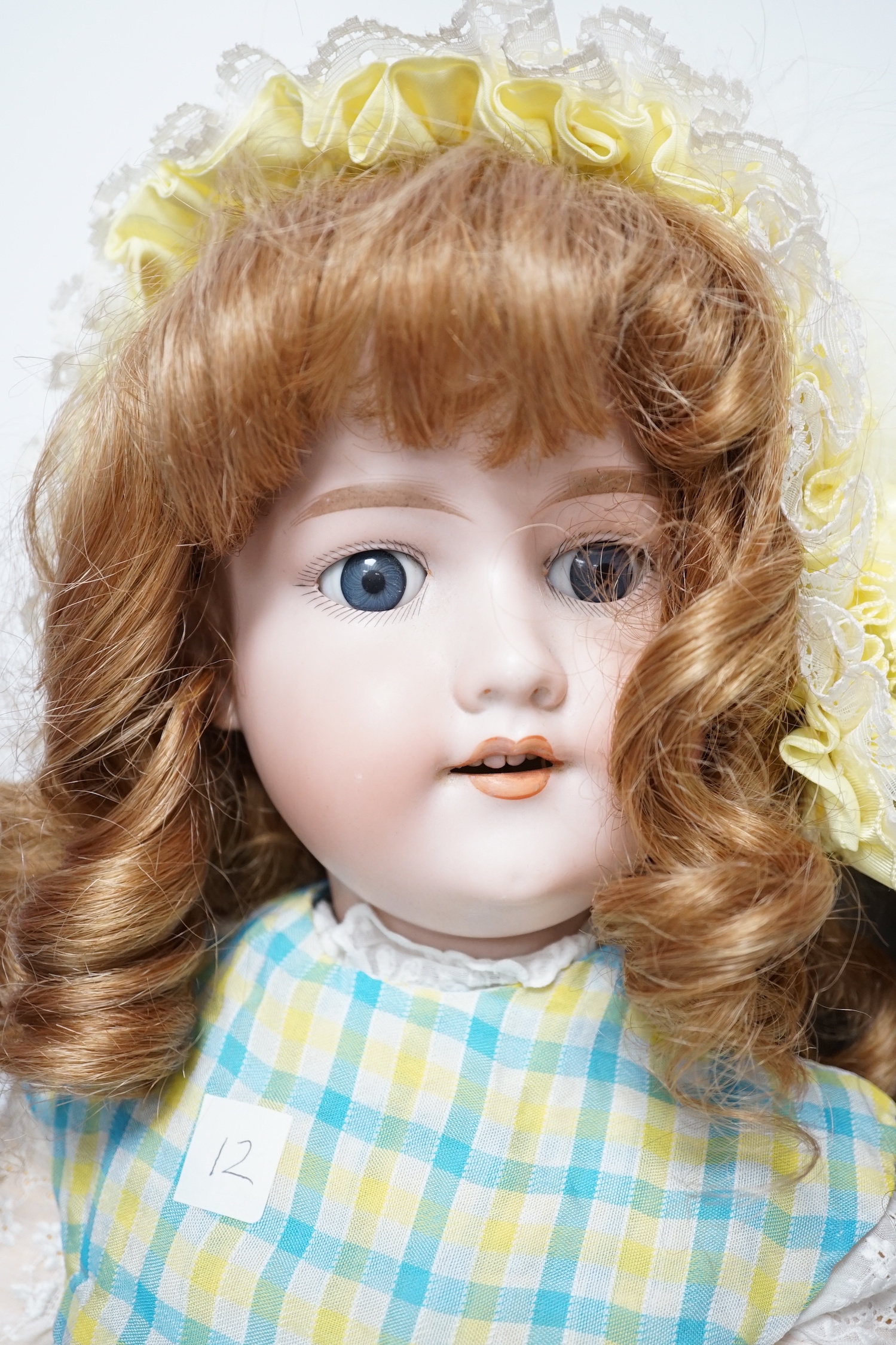 A Kestner JDK 168 bisque doll, 65cm and an AM390 doll with bisque head, 65cm